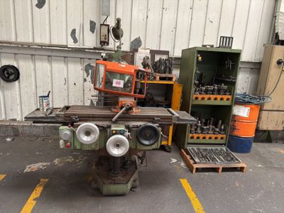 a machine that is sitting in a garage with other machines