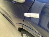a sticker on the side of a blue car