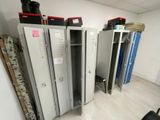 several metal lockers are lined up in a row in a room