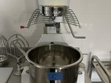 a mixer that is sitting on a counter in a kitchen