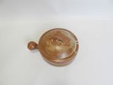 a small brown pot with a lid on a table