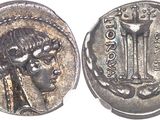 a close up of a silver coin with a woman on it