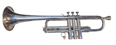 a silver trumpet that is sitting on a white surface