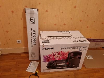 a box and a pair of scissors sitting on the floor