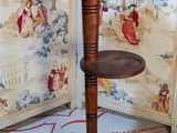 a small wooden table with a shelf on top of it