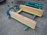 several pieces of wood are sitting on top of a cart