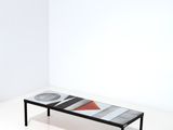 a black and white bench with a red and white design on it