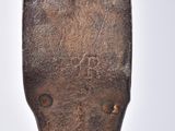 a close up of a hammer that has been used to repair a piece of wood