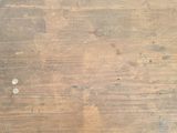 a wooden floor that has been cleaned and is dirty