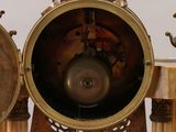 a clock that is sitting on a table with a clock on it