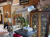 an image of a room with antique furniture and antiques