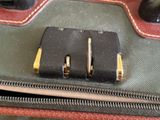 a piece of luggage that has two pieces of luggage in it