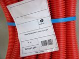 a bag of red coiled hoses with a price tag on it