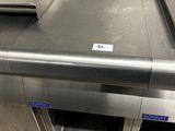 stainless steel counter top in a commercial kitchen with a lot of counter space