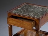 a small table with a marble top on it