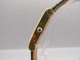 an image of a close up of a watch on a table