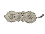 a close up of a bracelet on a white background