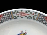 a white plate with a fish design on it
