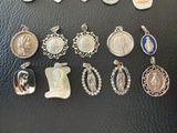 a lot of religious charms on a black surface