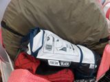 a pile of clothes in a bag on the ground