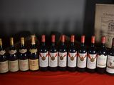 several bottles of wine are lined up on a table