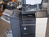 a printer sitting on top of a cart in a garage