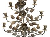 an image of a metal candelier with roses and leaves
