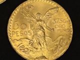two gold coins with the image of a woman holding a sword