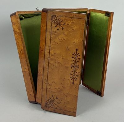 a small wooden box with a green cover on it