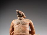 a statue of a man with a bird on his head