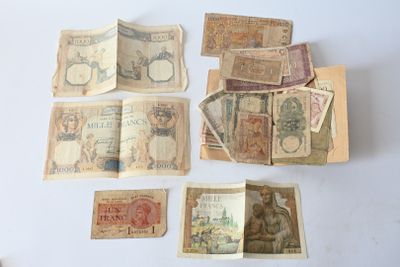 a lot of old money sitting on a table