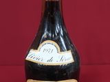 a bottle of wine that is sitting on a table