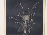 a picture of a vase with flowers in it