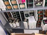 many boxes of hair products on a shelf in a store