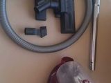 a picture of a vacuum and a hose on a table
