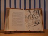 an open book with a drawing of a group of people on it