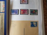 an open book with stamps on it on a table
