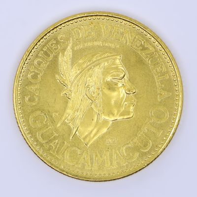 an image of a close up of a gold coin with a woman ' s face