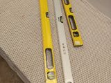 two tools that are laying on the floor