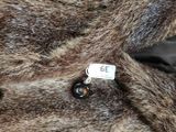 a close up of a fur coat with a tag on it