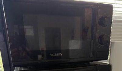 a microwave sitting on top of a microwave oven