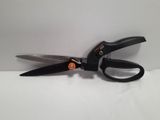 a pair of scissors on a table with a white background