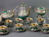 many different types of tea and coffee sets on the table