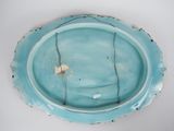 a blue plate with a small piece of food on it