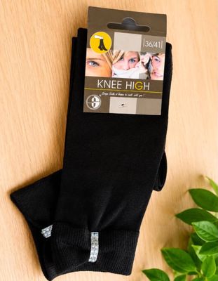 a close up of a pair of knee high socks on a table