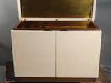 an image of a white and gold chest on wheels