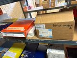 many boxes on the shelf in the store for sale