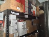 many boxes of wine sitting on a shelf in a store