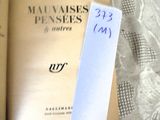 a book with a bookmark on top of it next to a book