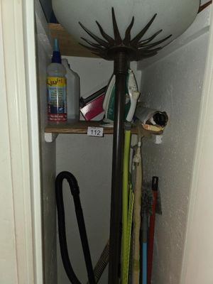 an image of a bathroom with a sink and a hose